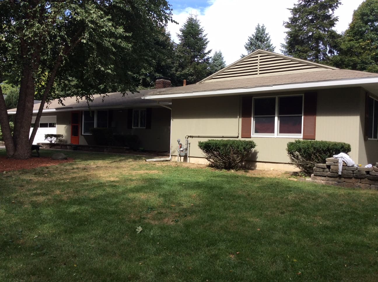 Ranch house exterior with tan siding