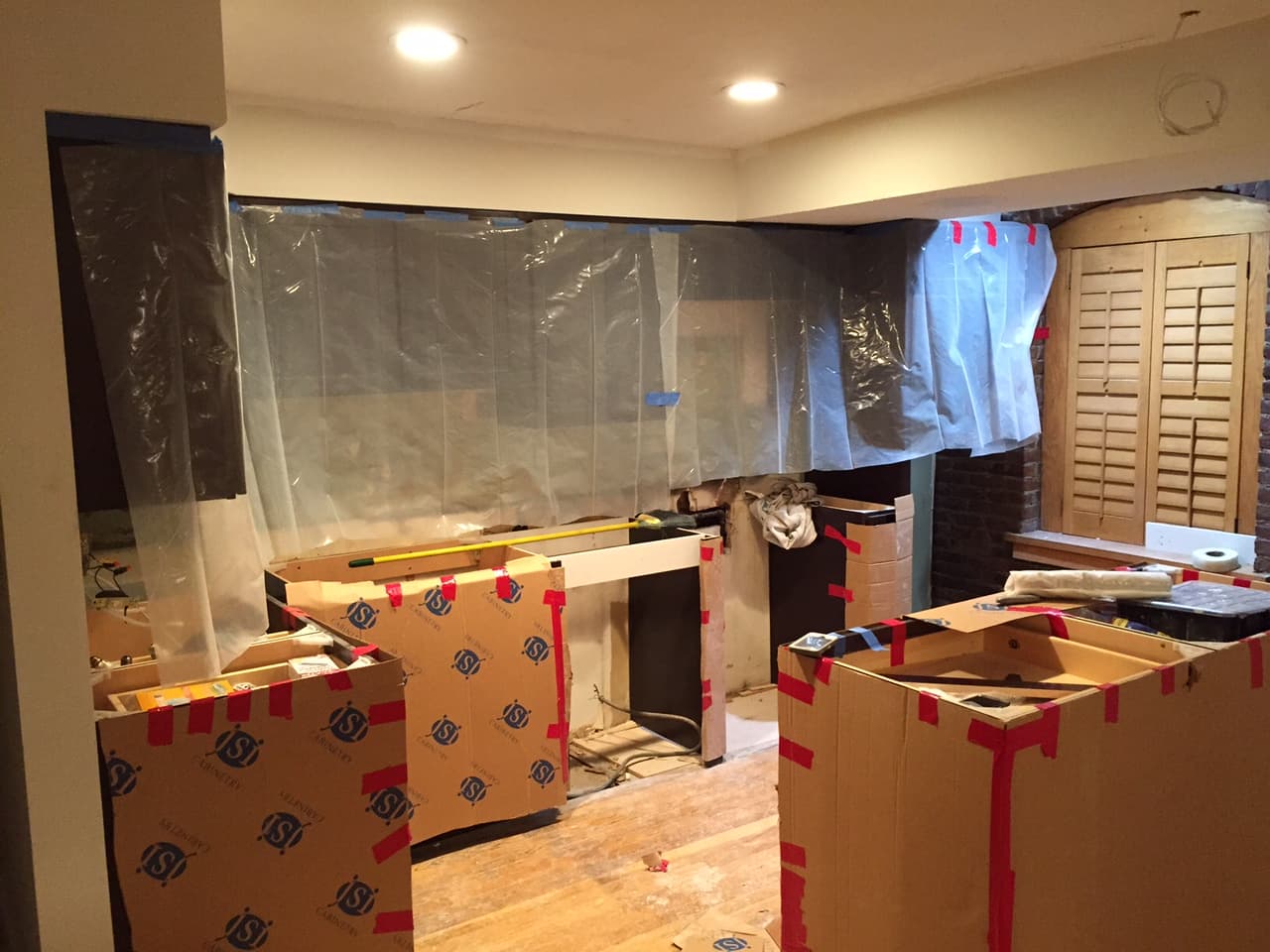 Kitchen cabinets being installed