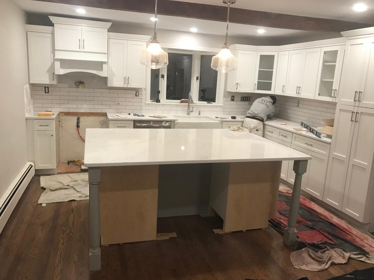 White kitchen with a new island before the counters go on